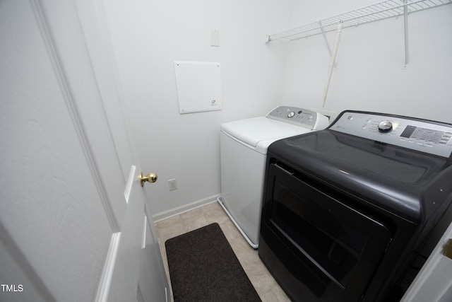 laundry area with washing machine and clothes dryer