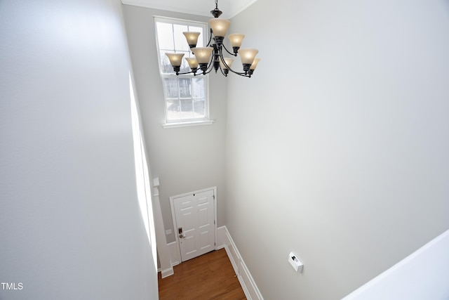 interior space featuring hardwood / wood-style floors and a notable chandelier