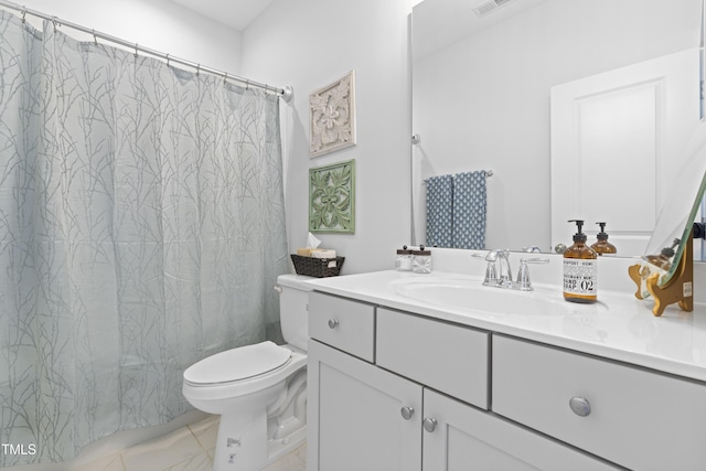 bathroom featuring vanity and toilet