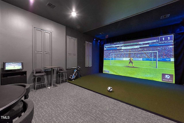 game room with golf simulator and carpet