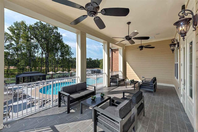 view of patio featuring a fenced in pool and an outdoor hangout area