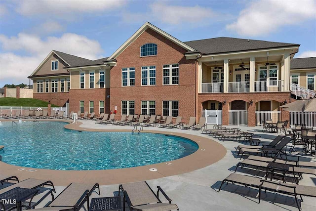 view of pool featuring ceiling fan and a patio area