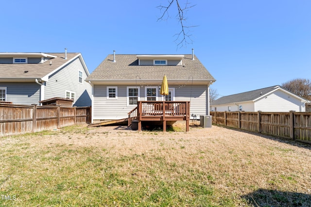 rear view of property with central AC, a yard, a fenced backyard, and a wooden deck