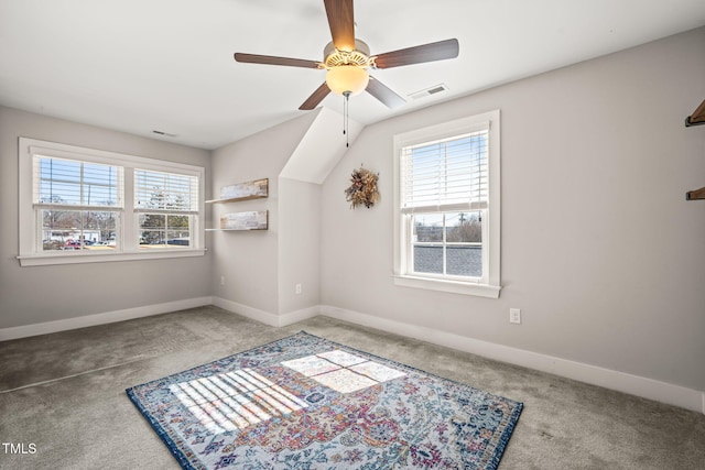 spare room with plenty of natural light, visible vents, and carpet flooring