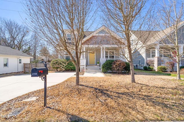 view of front of house featuring covered porch and concrete driveway