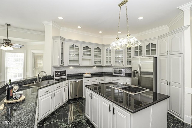 kitchen with stainless steel appliances, sink, and white cabinets