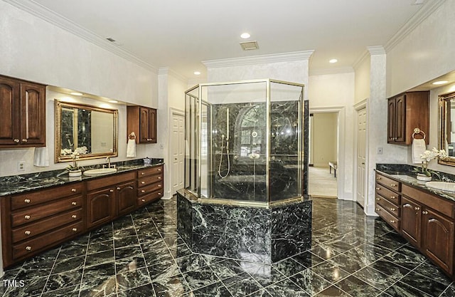 bathroom with vanity, crown molding, and independent shower and bath