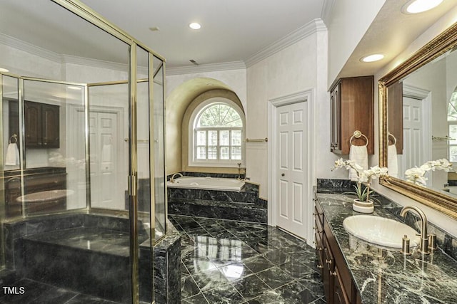 bathroom with vanity, crown molding, and separate shower and tub