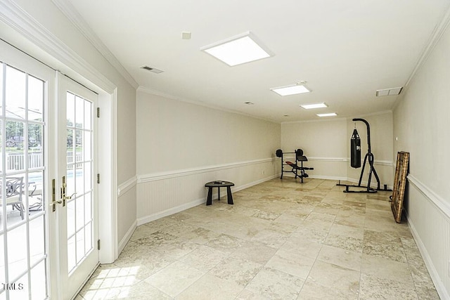 workout area with crown molding and french doors