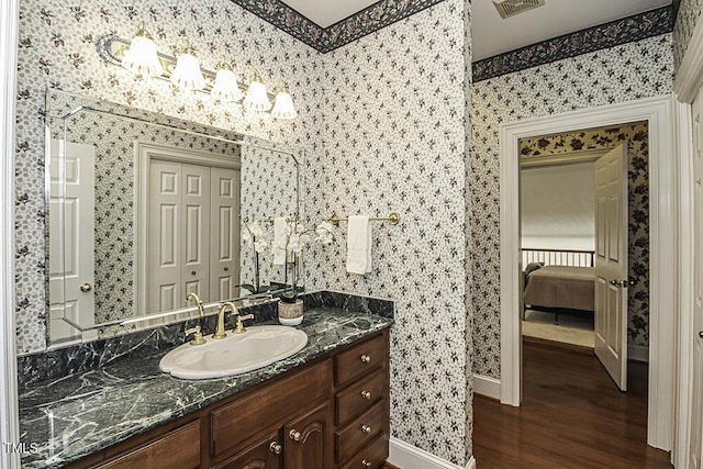 bathroom featuring vanity and hardwood / wood-style floors