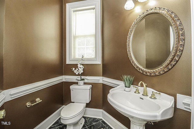 bathroom featuring toilet and sink