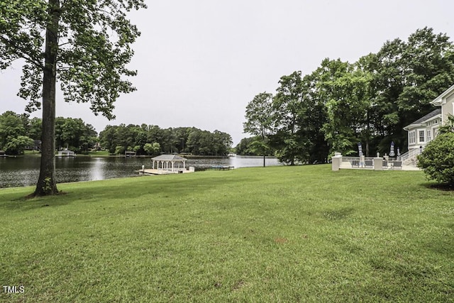 view of yard featuring a gazebo and a water view