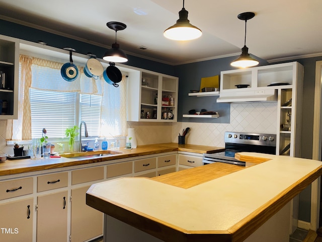 kitchen with electric stove, white cabinetry, and hanging light fixtures