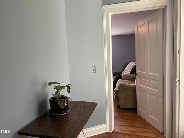 corridor featuring hardwood / wood-style floors