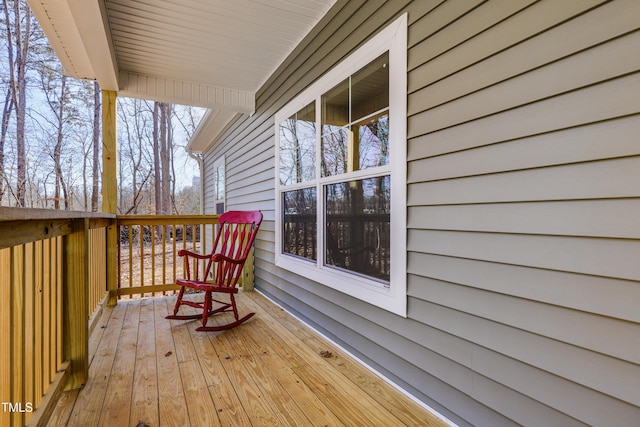 wooden terrace featuring covered porch