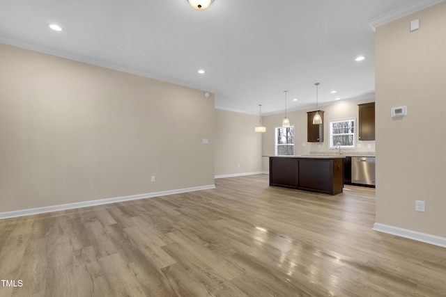 unfurnished living room with crown molding and light hardwood / wood-style flooring