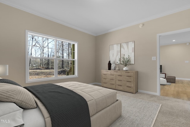 carpeted bedroom with ornamental molding