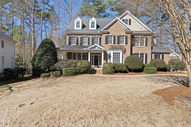 view of front facade featuring brick siding