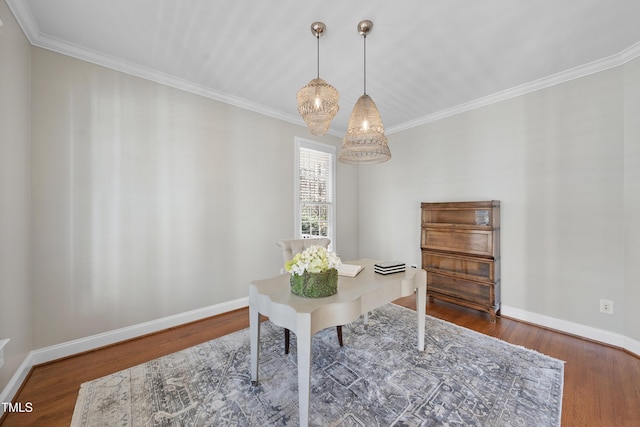 office featuring crown molding, wood finished floors, and baseboards