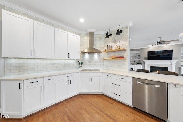 kitchen featuring crown molding, dishwasher, wall chimney range hood, and black electric stovetop