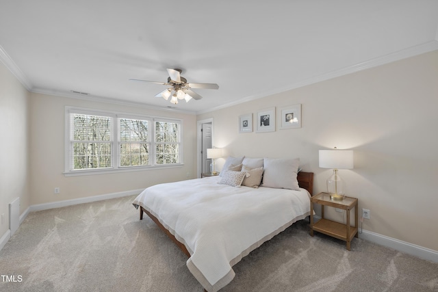 carpeted bedroom featuring ceiling fan, ornamental molding, and baseboards