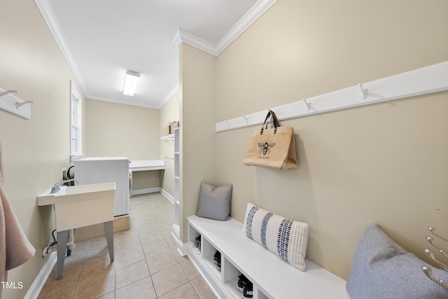 interior space featuring ornamental molding, tile patterned flooring, and baseboards