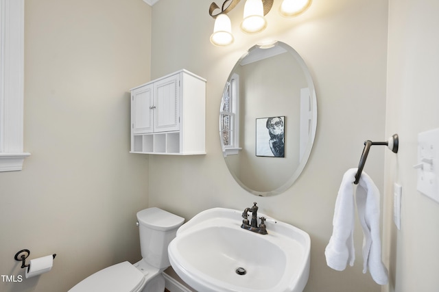 bathroom featuring a sink and toilet