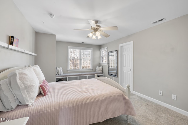 bedroom featuring carpet floors, baseboards, visible vents, and a ceiling fan