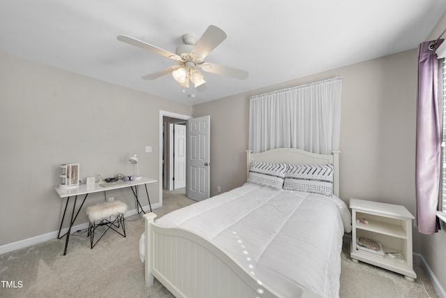 bedroom featuring ceiling fan, carpet, and baseboards