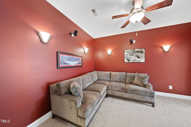 carpeted cinema featuring lofted ceiling, baseboards, visible vents, and ceiling fan