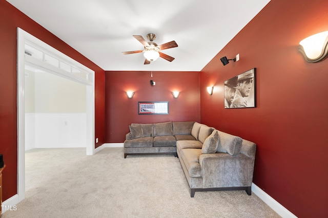 interior space featuring ceiling fan, carpet, and baseboards