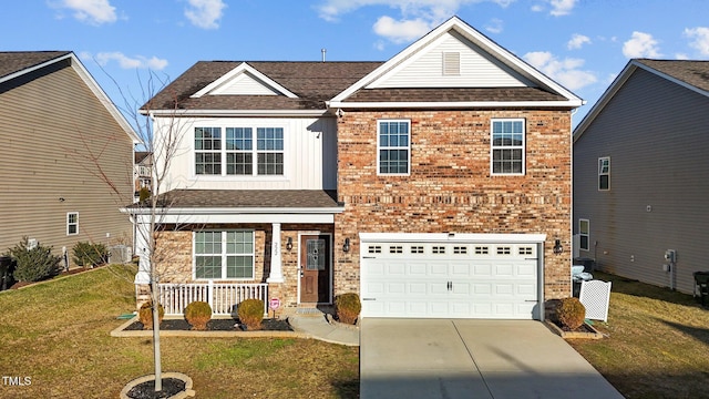 view of front of home featuring a garage, a porch, and a front yard