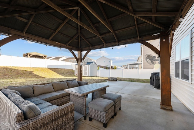 view of patio with a gazebo and a shed