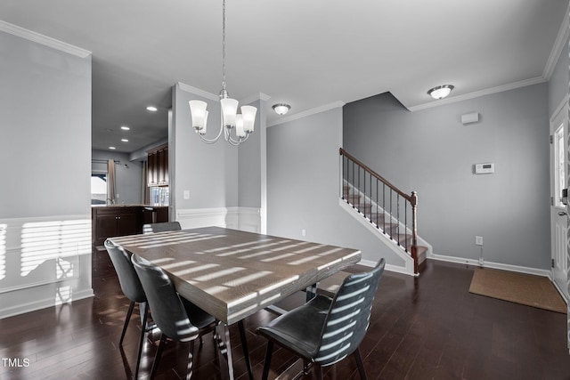 dining space with ornamental molding, dark wood-type flooring, and a chandelier