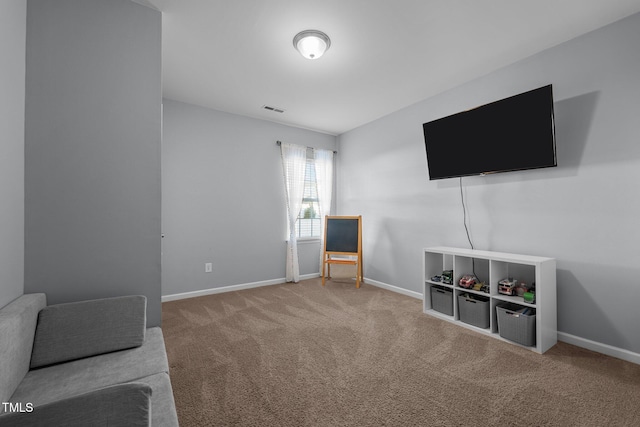 living area with carpet flooring