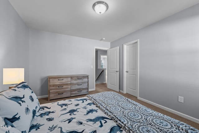 bedroom with light colored carpet