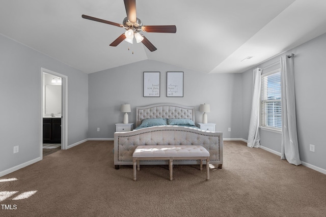 carpeted bedroom featuring ceiling fan, lofted ceiling, and ensuite bathroom