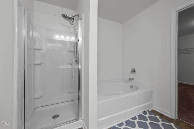 bathroom with shower with separate bathtub