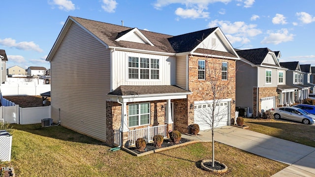 view of front of house featuring a garage and a front yard