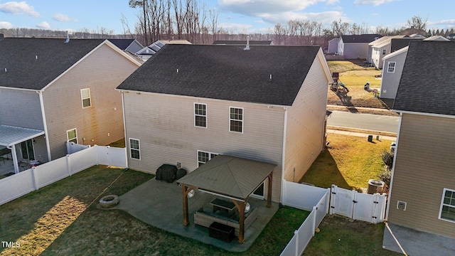 back of property featuring a patio area and a lawn