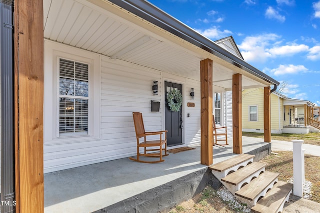 doorway to property featuring a porch