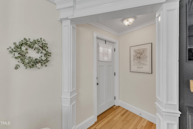 interior space with crown molding and light hardwood / wood-style flooring