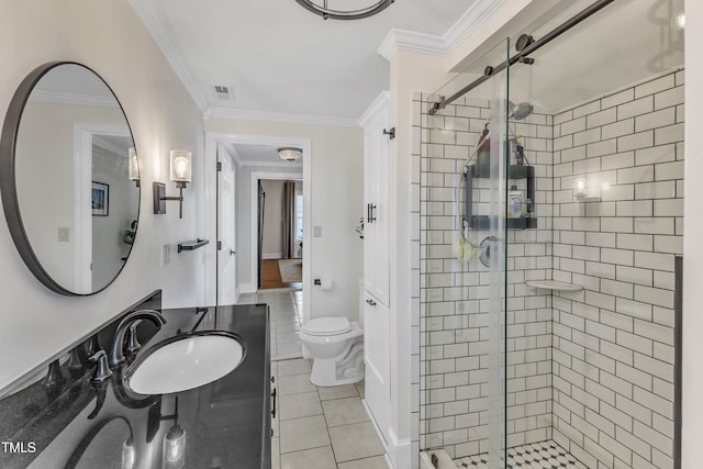 bathroom with tile patterned flooring, vanity, ornamental molding, a shower with shower door, and toilet