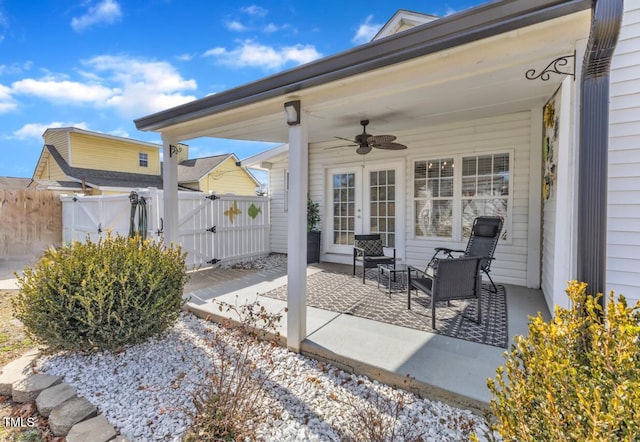 view of patio with ceiling fan and french doors