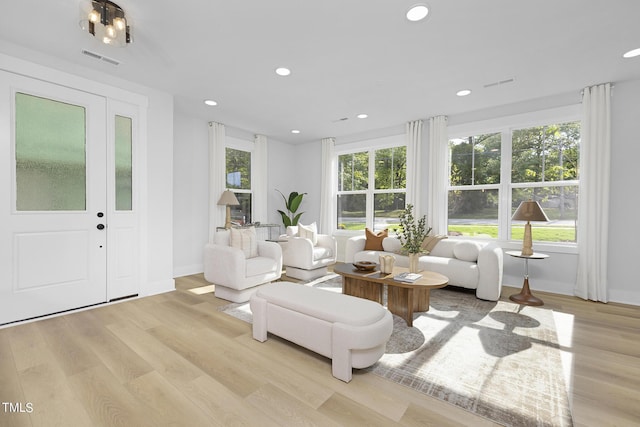 living room with light hardwood / wood-style flooring