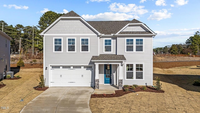 view of front of property featuring a garage