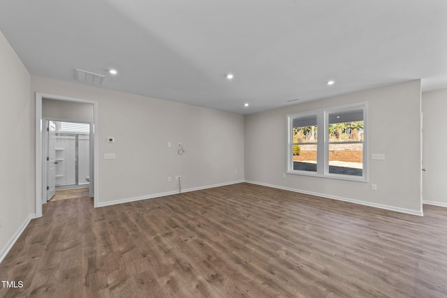 empty room featuring hardwood / wood-style flooring