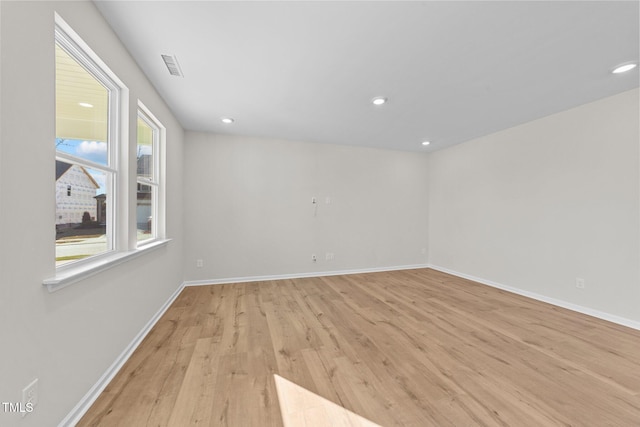 unfurnished room featuring light hardwood / wood-style floors