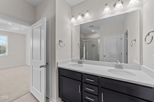 bathroom featuring tile patterned flooring, vanity, and an enclosed shower