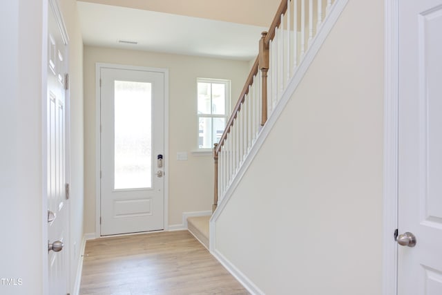 foyer with plenty of natural light and light wood-type flooring